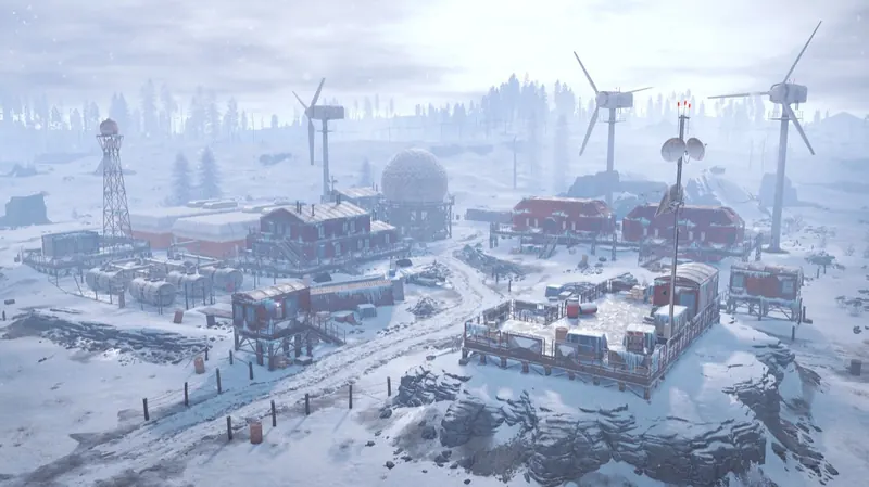 A snow-covered Arctic Research Base with a radar dome and wind turbines, seen from a hill