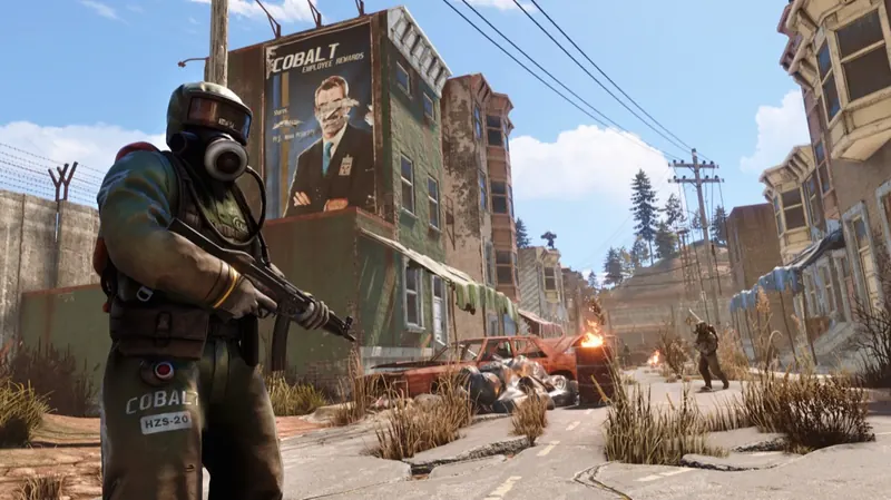 A hazmat-suited player holding a Thompson in a ruined town street with burning cars and another player further down the road